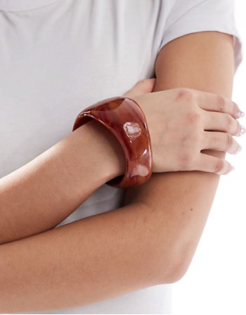 bangle bracelet with abstract detail in amber