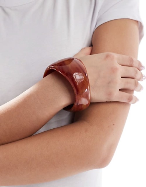 bangle bracelet with abstract detail in amber