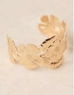 cuff bracelet with floral detail in gold tone