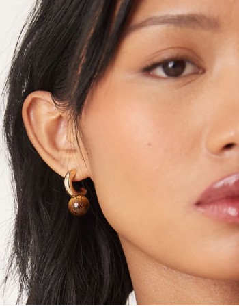 hoop earrings with real tigers eye ball detail in gold tone