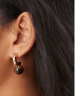 hoop earrings with real tigers eye ball detail in gold tone