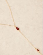 lariat necklace with red crystals in gold