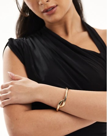 twisted knot bangle in gold