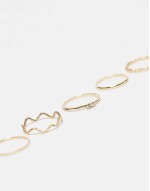 pack of 12 rings with twist details and engraved designs in gold tone