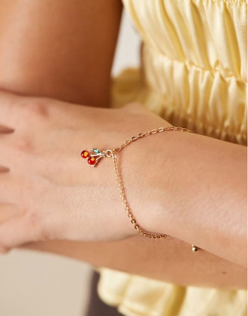 cherry charm bracelet in gold
